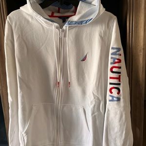 White sweater with blue and red